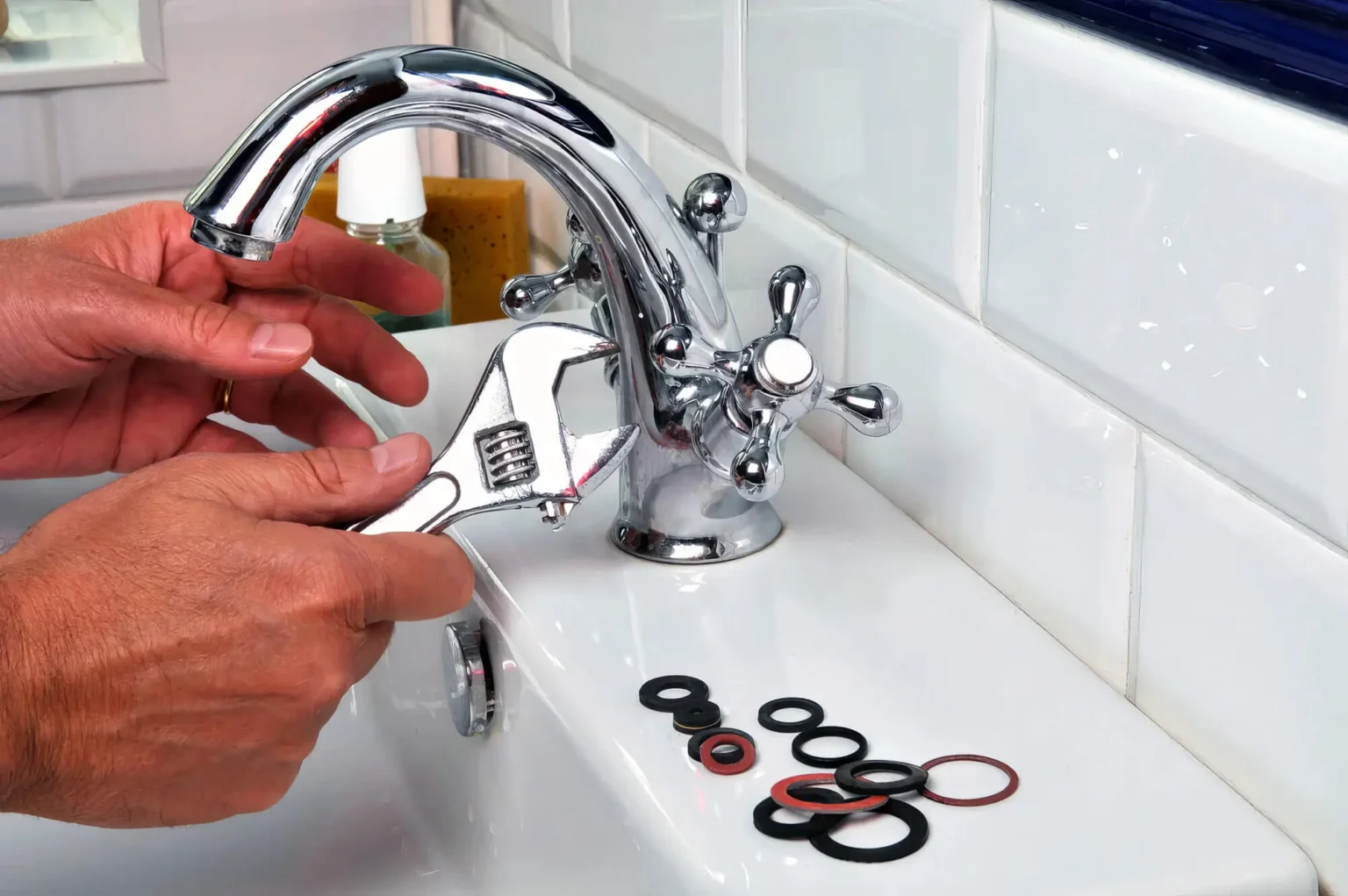 Plumber maintaining a bathroom faucet in Windsor